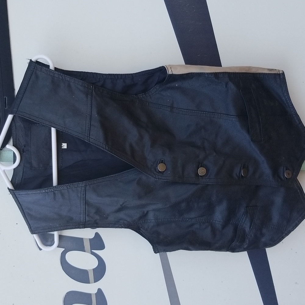 Black leather with canvas backed vest